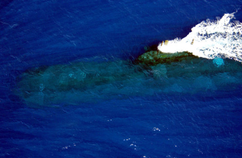 HMAS_Rankin_Australian Collins Class submarine IAFOR THINK Pacific Ocean (July 6, 2004) - Australia's Collins-class submarine, HMAS Rankin (SSK 78) cruises out to sea at periscope depth, and is scheduled to participate in exercise Rim of the Pacific (RIMPAC) 2004. RIMPAC is the largest international maritime exercise in the waters around the Hawaiian Islands. This year’s exercise includes seven participating nations; Australia, Canada, Chile, Japan, South Korea, United Kingdom and United States. RIMPAC is intended to enhance the tactical proficiency of participating units in a wide array of combined operations at sea, while enhancing stability in the Pacific Rim region. U.S. Navy photo by Photographer's Mate 1st Class David A. Levy (RELEASED) For more information go to: http://www.cpf.navy.mil/RIMPAC2004